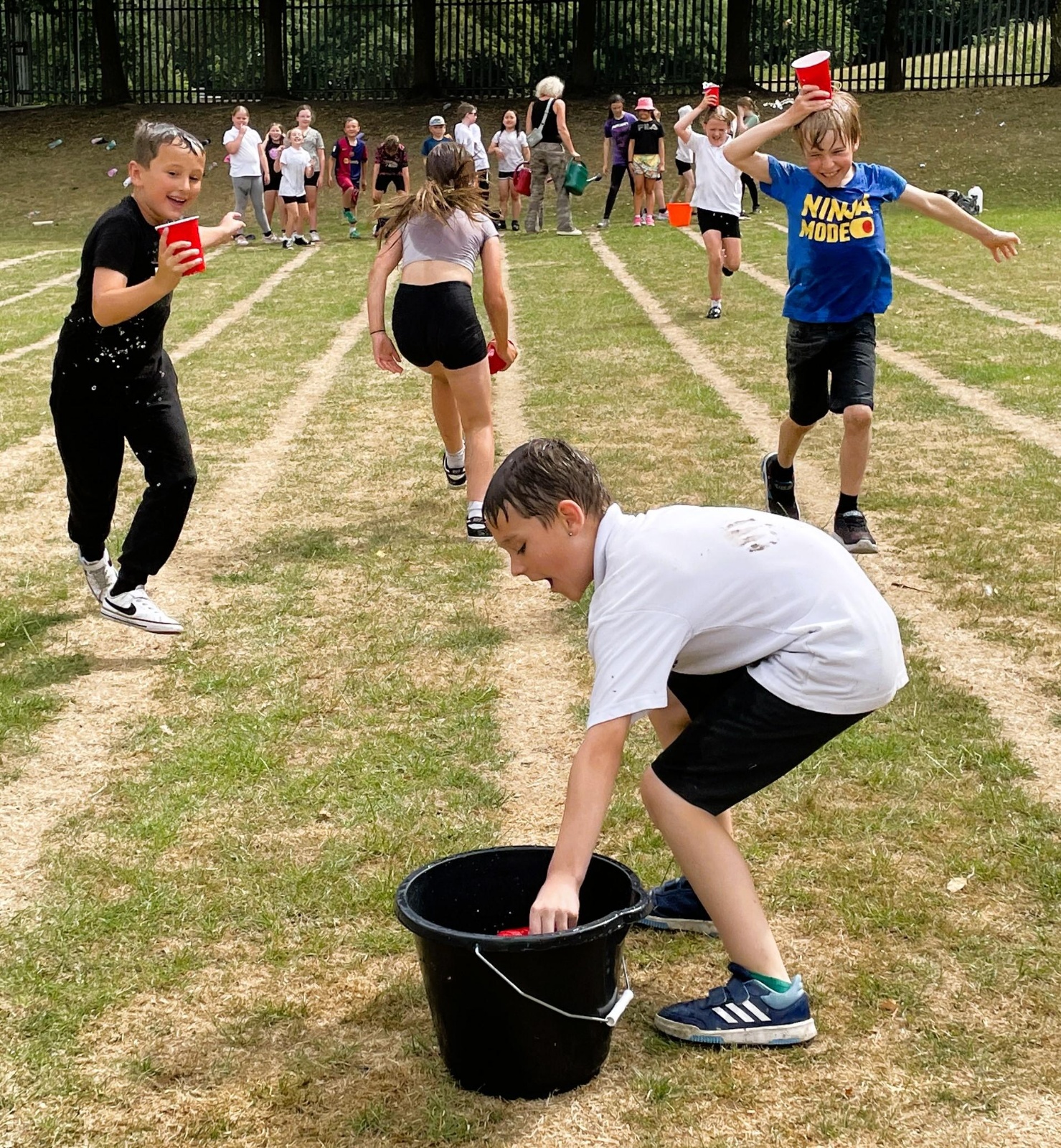 Children playing an outdoor relay game at school